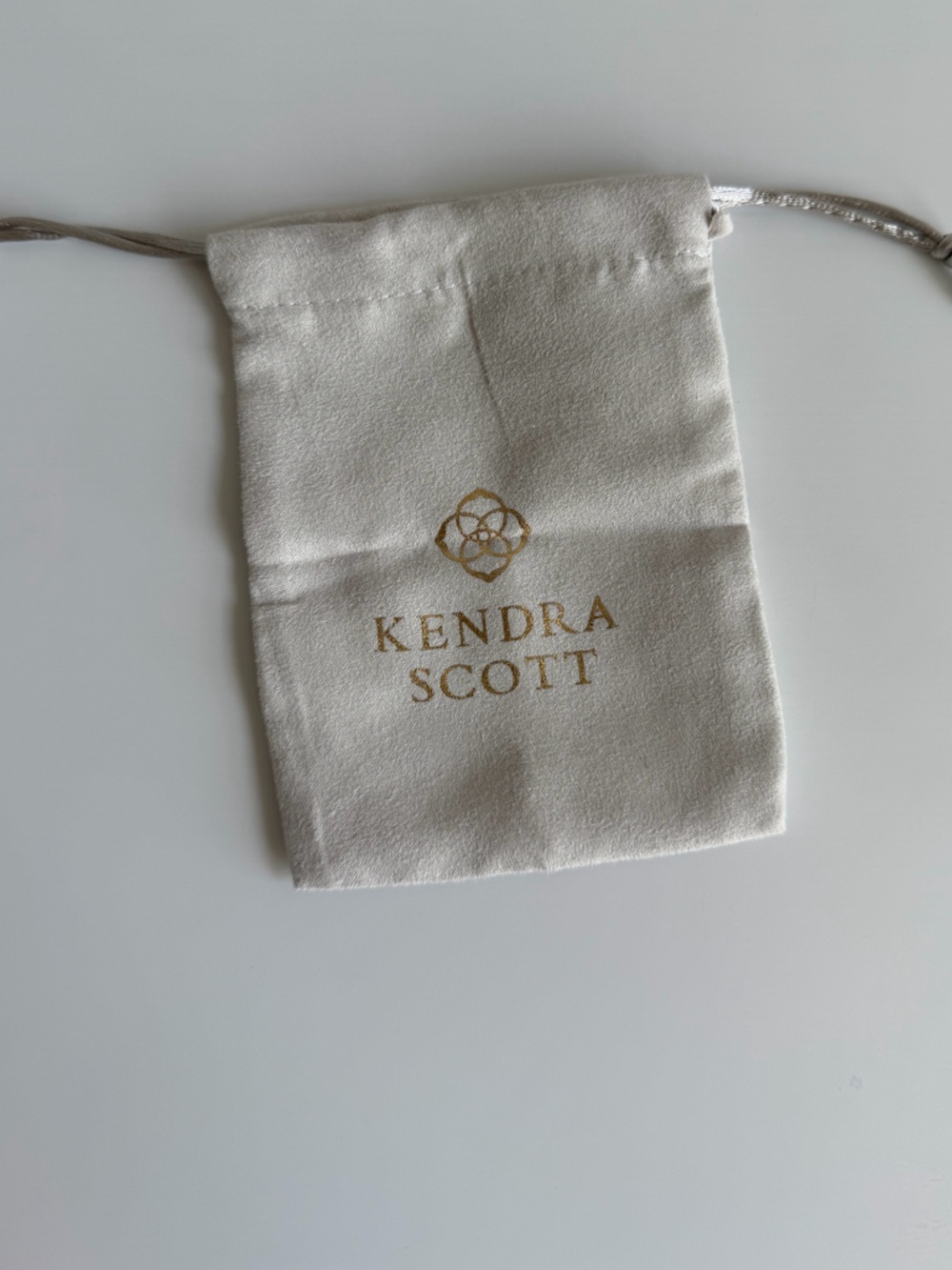 Kendra Scott Cream Drawstring Pouch with Gold Logo